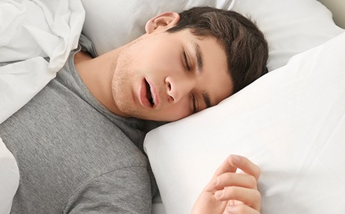 Man struggling with sleep apnea in Delafield