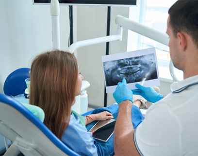 Dentist discussing a dental bridge in Delafield 