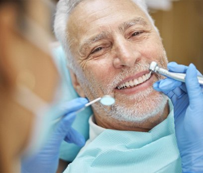 Man smiling with dental bridge in Delafield 