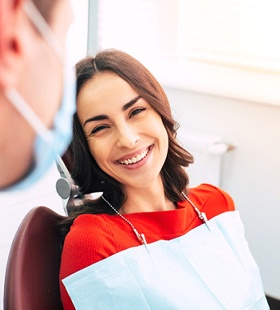 Woman smiling at cosmetic dentist in Delafield