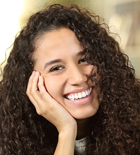 Woman smiling after cosmetic dentistry in Delafield