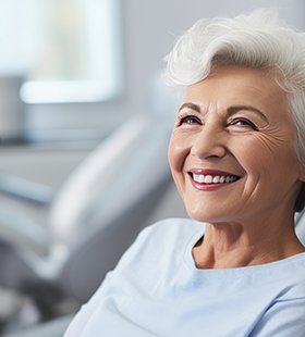 Older woman enjoying the benefits of dentures in Delafield