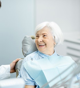 Older woman talking with her dentist
