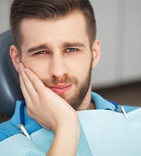 Man with toothache in Delafield visiting his emergency dentist 
