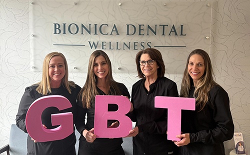 Bionica Dental Wellness team holding GBT letters in Delafield