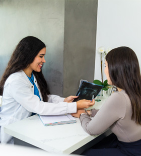 Dentist and patient discussing treatment 