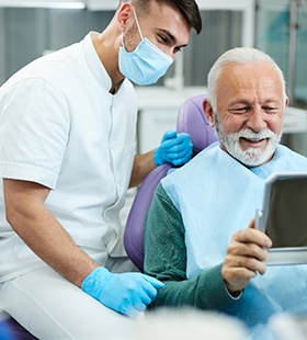 Man visiting dentist after receiving dental implants
