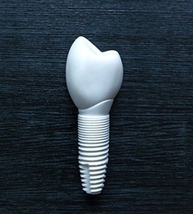 A complete, bioceramic dental implant that includes the post and custom-made dental crown secured to the top