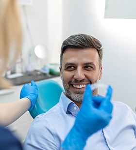 Man smiling in preparation to receive Invisalign