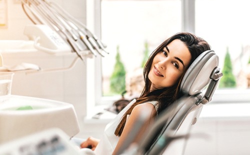 A woman smiling in the dentist’s chair