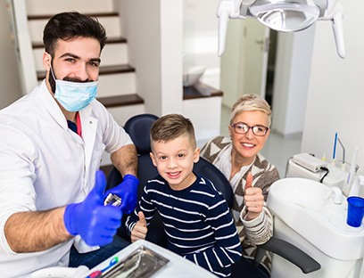 Boy smiling in the dentist’s office when learning about pediatric expansion in Delafield