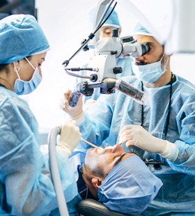 Dentists performing dental work on a patient