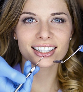 Woman receiving dental checkup