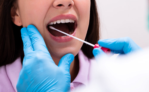 Woman undergoing saliva pH testing in Delafield 