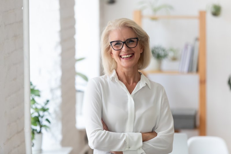 older woman smiling with dental implants