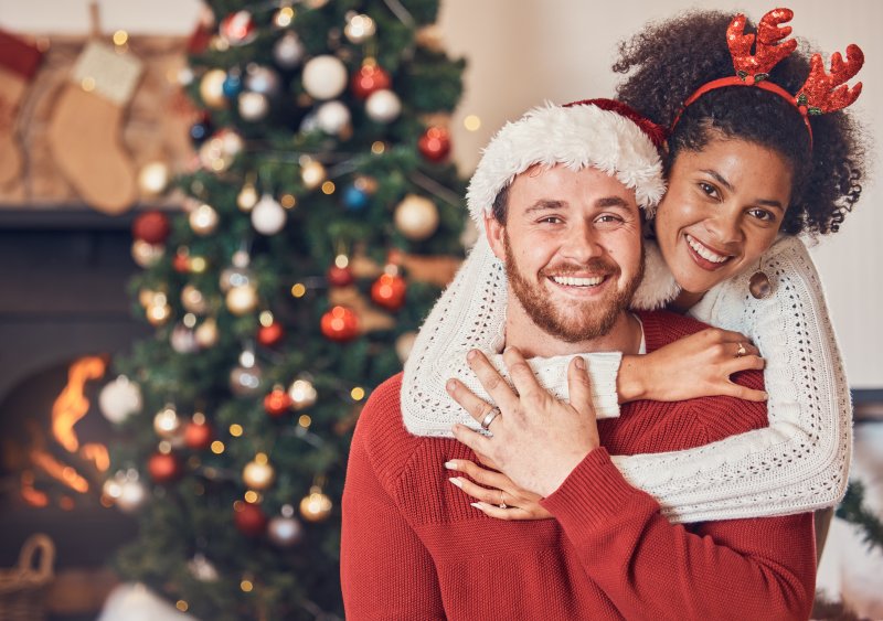 couple smiling at Christmas